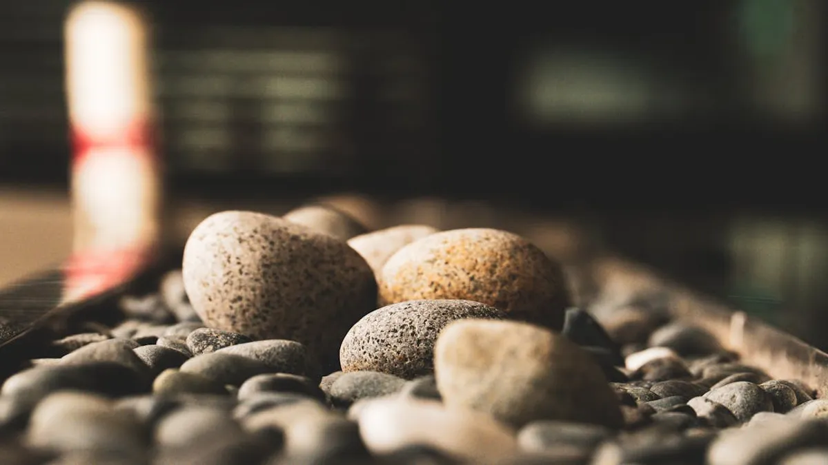 A serene close-up of smooth mixed-color pebbles, offering a calming aesthetic with soft focus background.